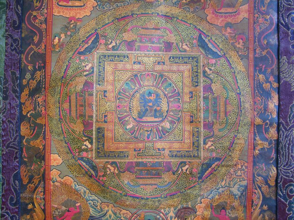 Chakrasamvara Mandala 07 All Circles The mandala serves as a two-dimensional map that guides the meditator's visualization of a fully realized three-dimensional place and, at the same time, as a place that the meditator mentally explores. The meditator visualizes, in three dimensions, each and every element of the mandala. Moving toward the center of the mandala, there is a circle, a ring of flames, which burns away spiritual obstacles. After a small second circle, the third innermost circle consists of lotus flower petals that unfold spiritual vision. The meditator approaches the four-walled palace where the deities live after crossing these moatlike outer circles.